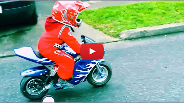 A 3-year-old boy rides an electric Pocket Bike from Nitro Motors